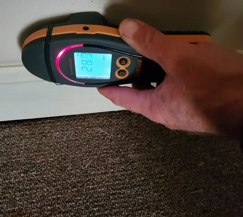 Moisture detection at baseboard during Storm Damage Restoration in Warrenton